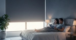Asian couple relaxing in a bedroom with effective blackout roller blinds by Ministry of Blind