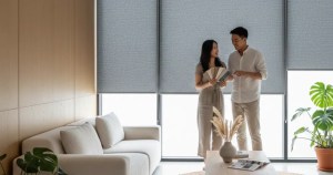 Modern Asian couple choosing roller blinds at Ministry of Blind Singapore